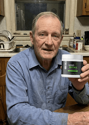 Stanley holding a bottle of mindrecall